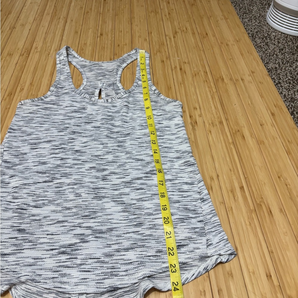 Lululemon tank with cut out back and optional back tie. No tags Measures a  4. - Picture 7 of 7